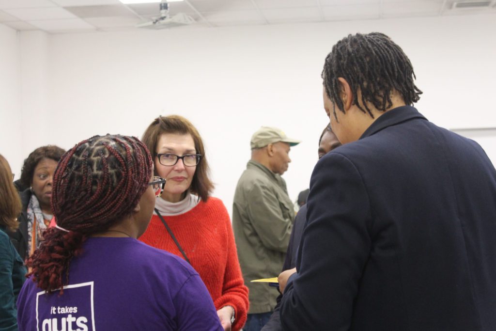 Christine Burt, Laura Chapman and patient partner Davina engaging in a conversation at community event