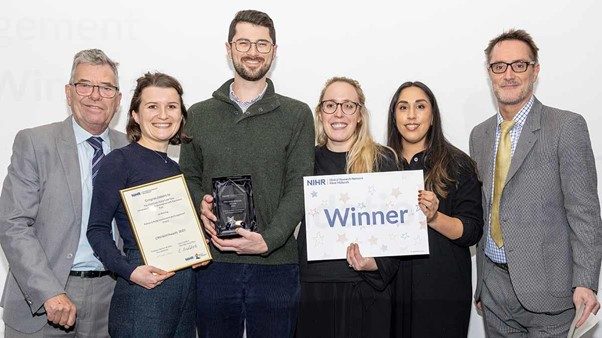 Representatives from the STANDING Together team receiving their award