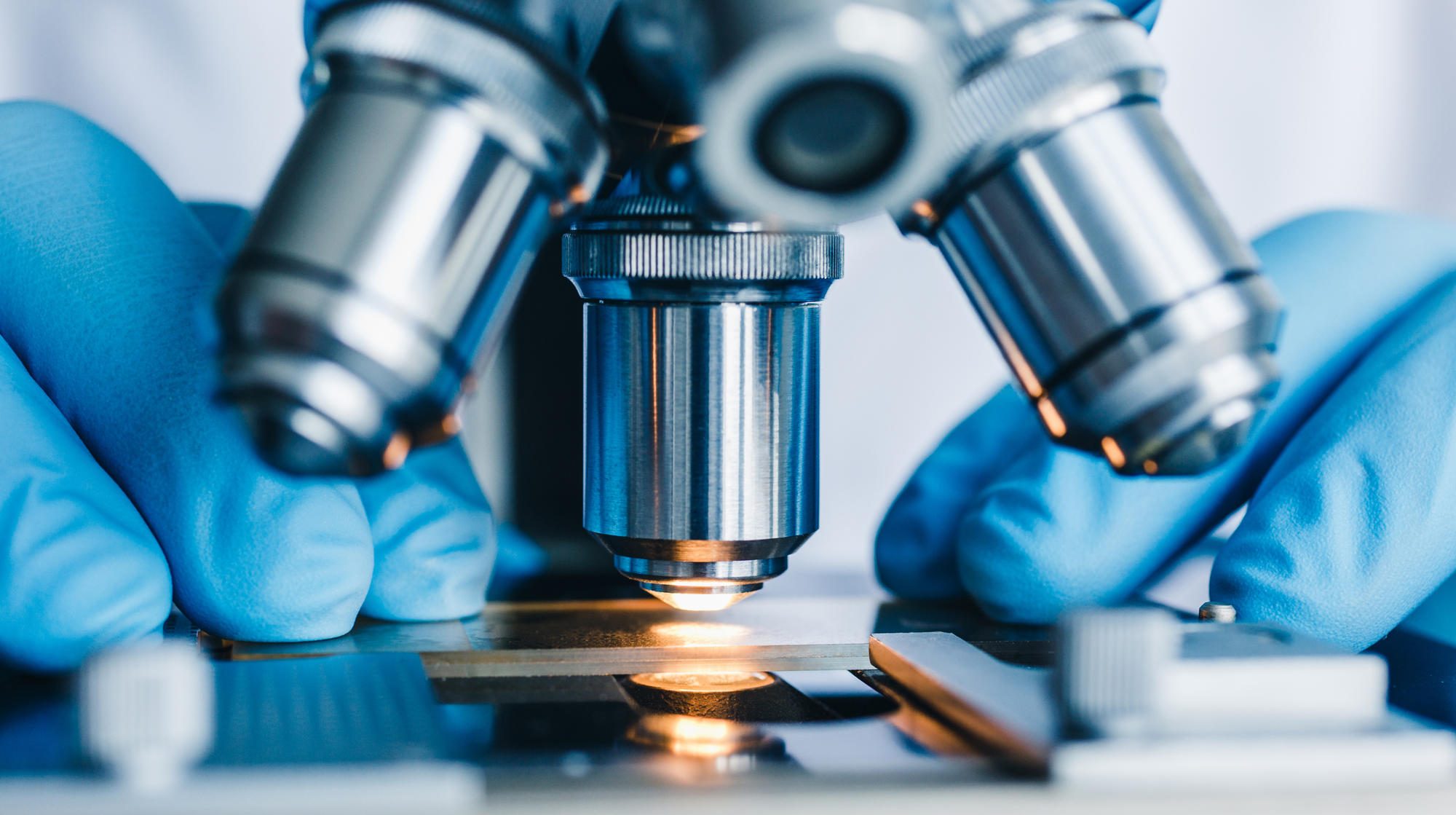 Close-up shot of microscope with metal lens at laboratory