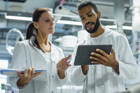 Two researchers collaborating in a laboratory environment.