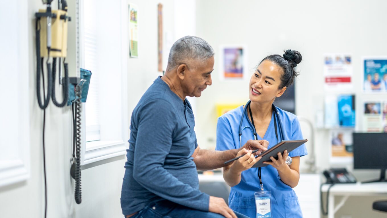 Healthcare professional discussing form with patient