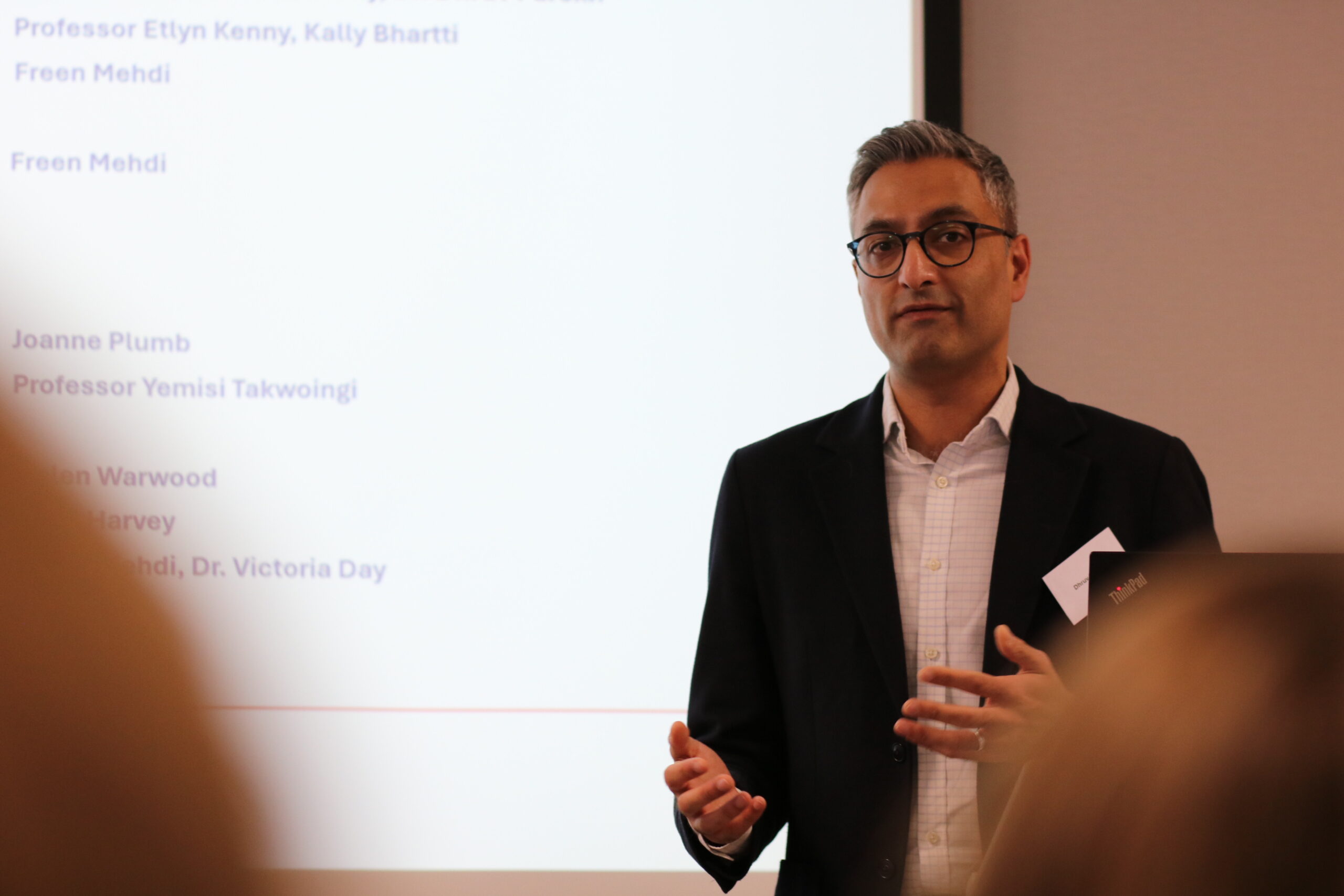 Dr Dhruv Parekh giving his welcome address on stage