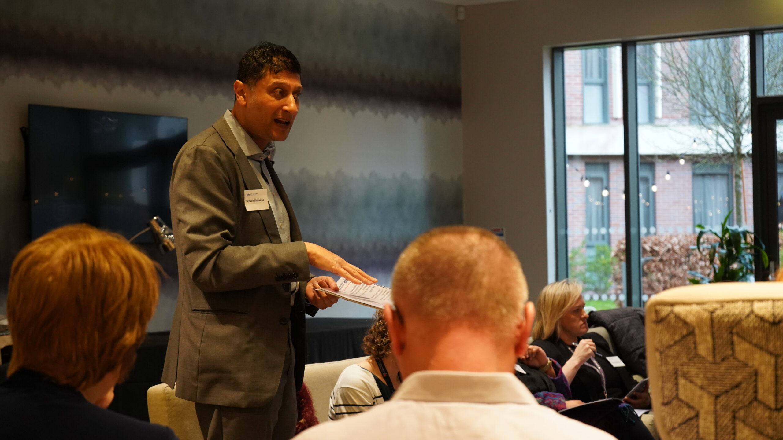 Table of attendees engaging in conversation