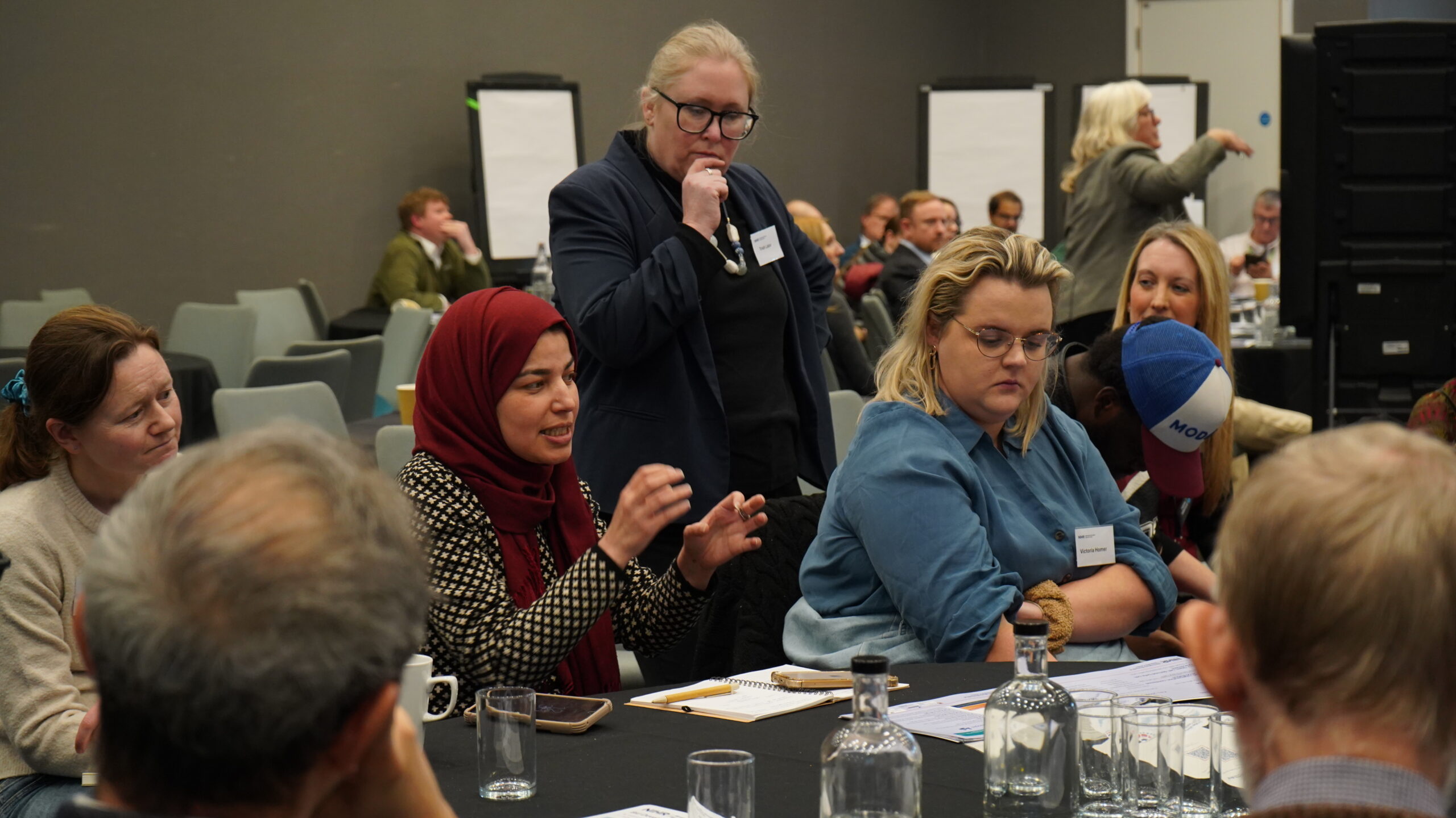 Table of attendees engaging in conversation