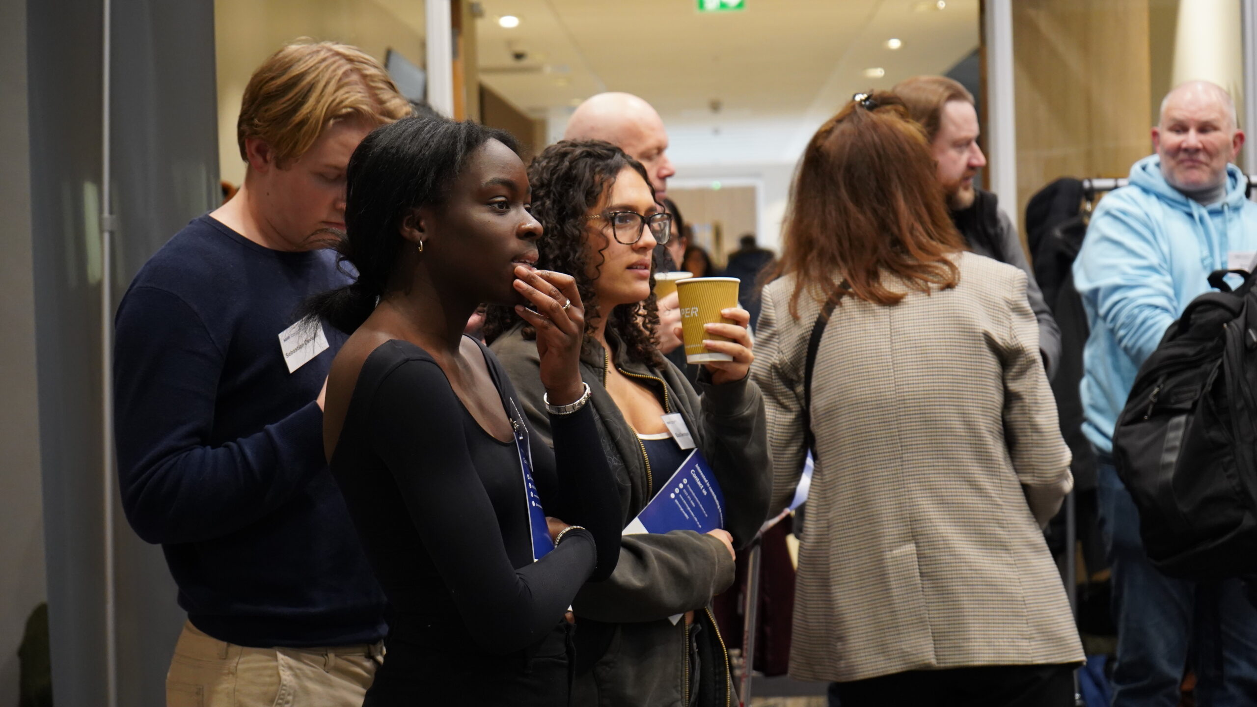 public contributors standing in the room