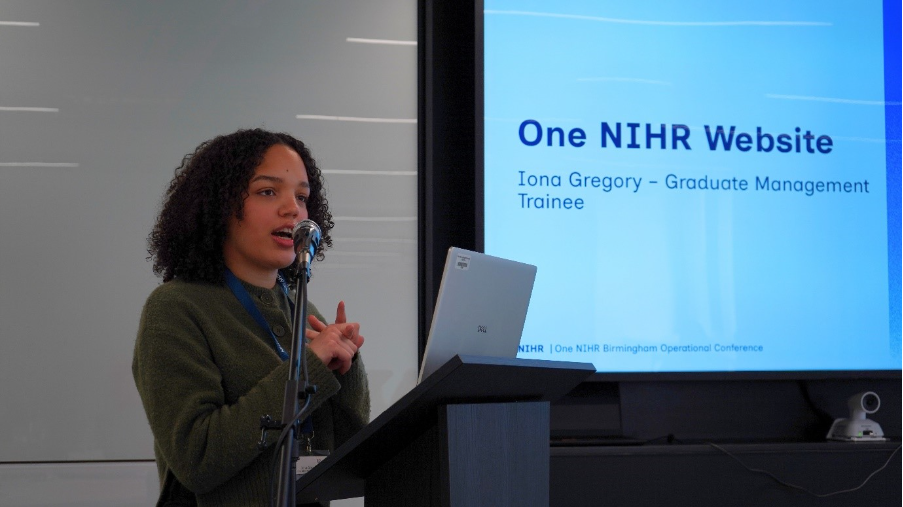 Iona Gregory presenting on stage