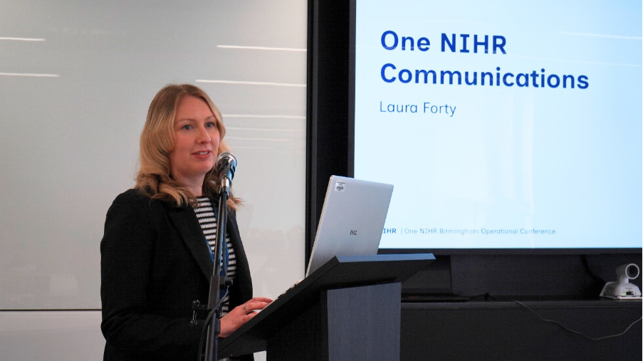 Laura Forty presenting on stage