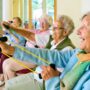 Elderly women doing resistance exercise to counteract sarcopenia