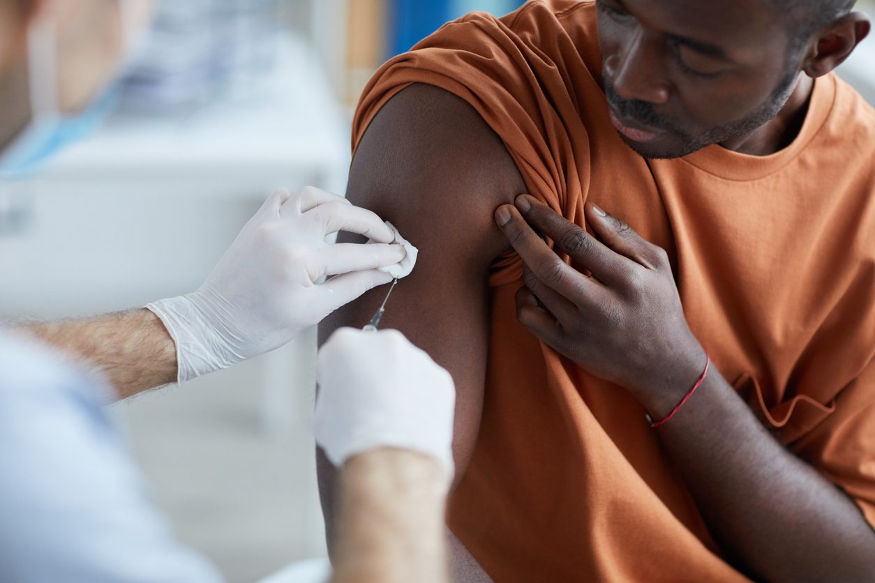 patient getting covid vaccine in upper arm