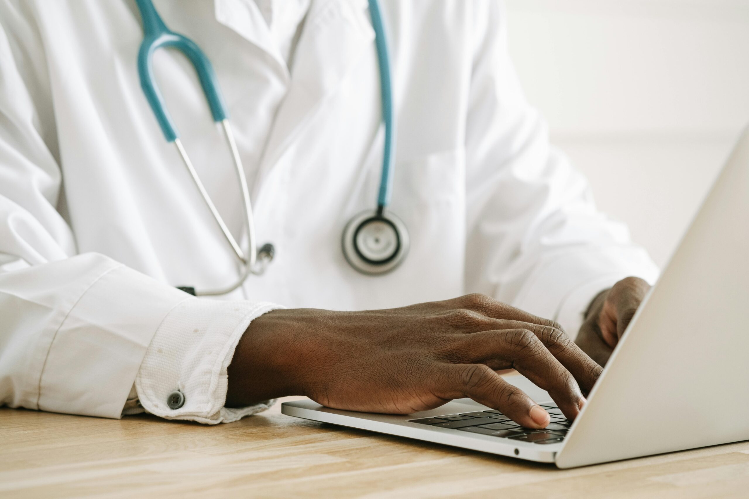 Doctor using laptop