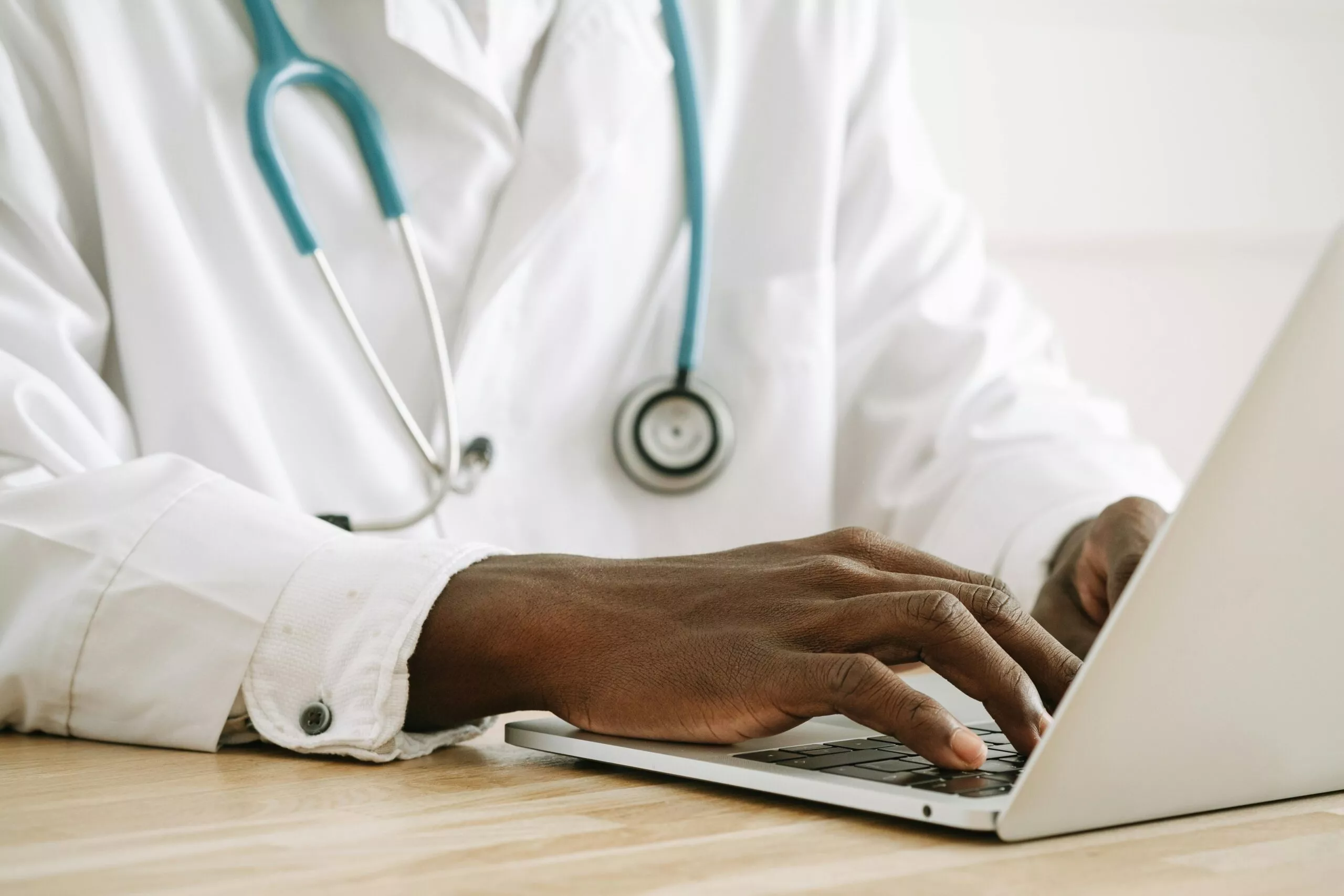 Doctor using laptop