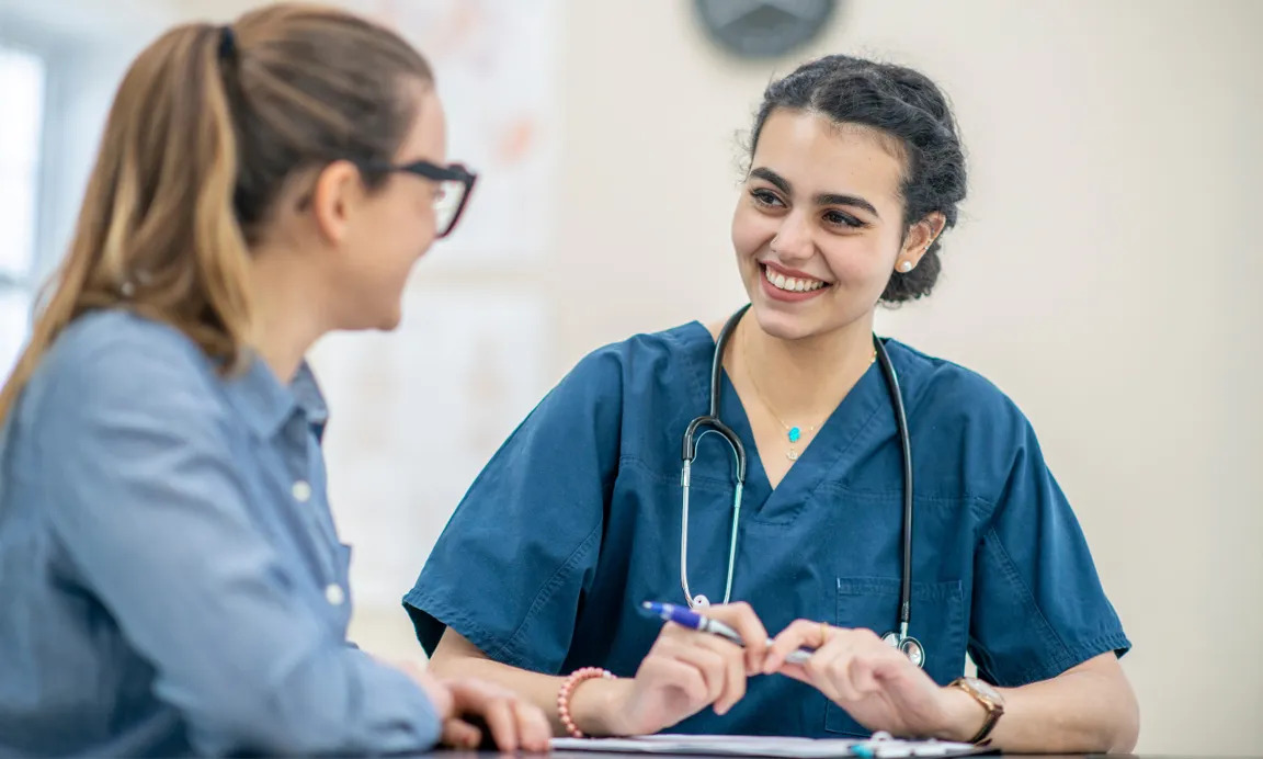 Nurse speaking with patient