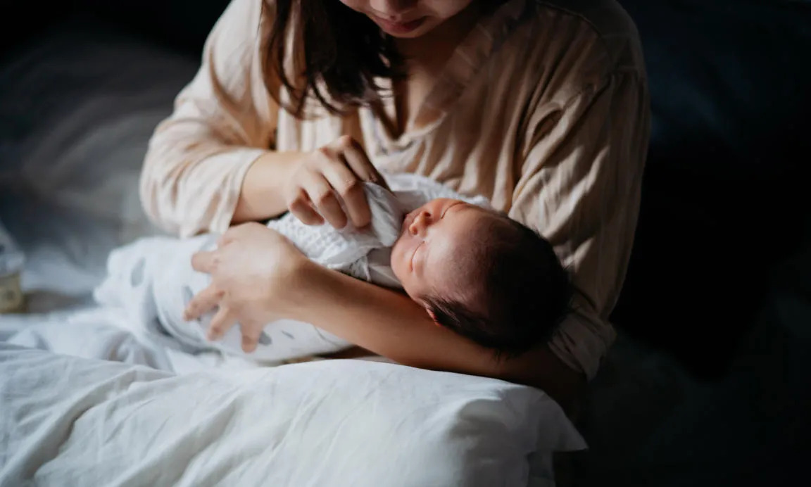 Woman with newborn baby