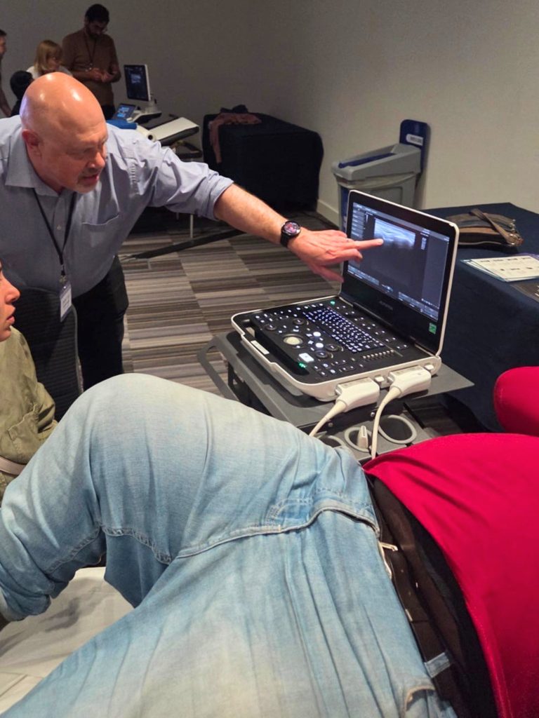 Man delivering training in ultrasound guided biopsy