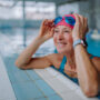 Senior woman exercising in swimming pool